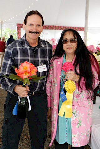 Sweepstakes winners, Dennis and Valerie McKiver show off some of their winning trusses. Photo by Dick Jones, Noyo Chapter American Rhododendron Society gallery image