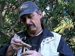 Gardens' Naturalist Mario Abreu identifying a mushroom